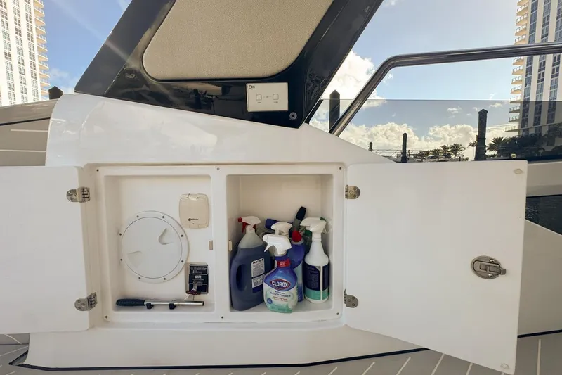 Slide: The Image of Open storage compartment on 2023 Azimut Verve 47 yacht with cleaning supplies. - 31