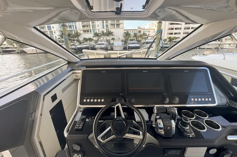Slide: The Image of 2023 Azimut Verve 47 yacht helm with advanced navigation displays and controls. - 36