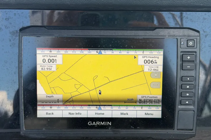 Slide: The Image of Garmin GPS display on 2023 Crownline Eclipse E235 XS, showing navigation details and coordinates. - 33