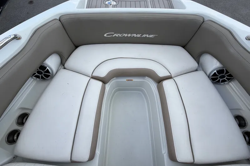 Slide: The Image of The image shows the bow area of a Crownline Eclipse E235 XS boat with cushioned seating. - 45