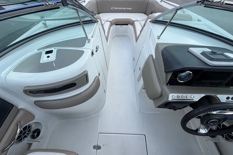 Slide: The Image of 2023 Crownline Eclipse E235 XS boat interior with modern dashboard and seating. - 40