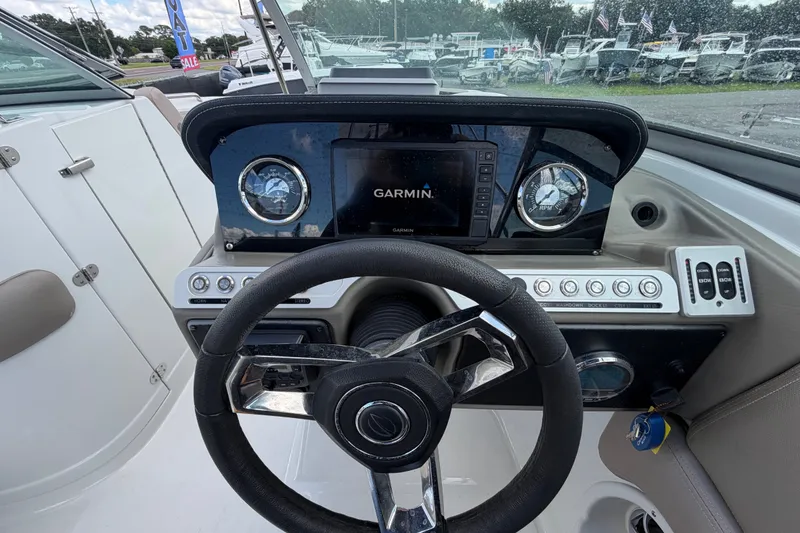 Slide: The Image of 2023 Crownline Eclipse E235 XS boat dashboard with Garmin navigation system. - 32