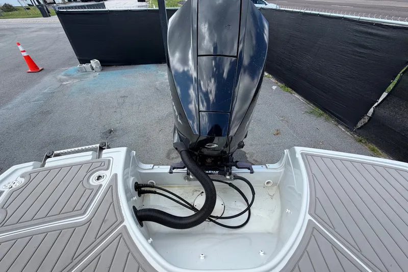 Slide: The Image of 2023 Crownline Eclipse E235 XS boat engine and deck view. - 74