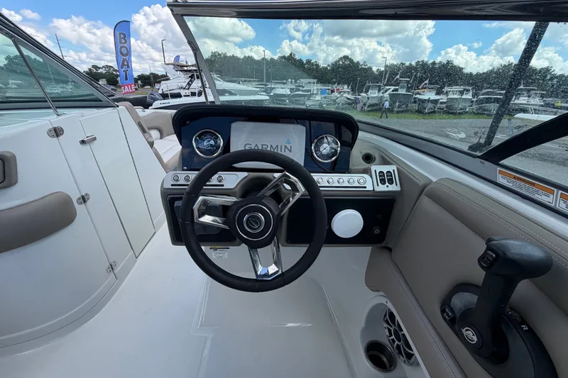 Slide: The Image of 2023 Crownline Eclipse E235 XS boat dashboard with Garmin navigation system. - 30