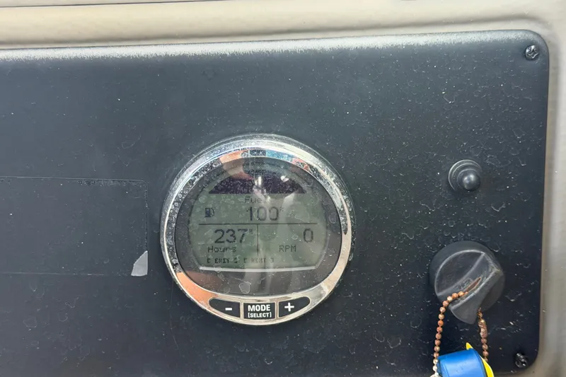 Slide: The Image of Dashboard of 2023 Crownline Eclipse E235 XS showing 237 hours and RPM gauge. - 35