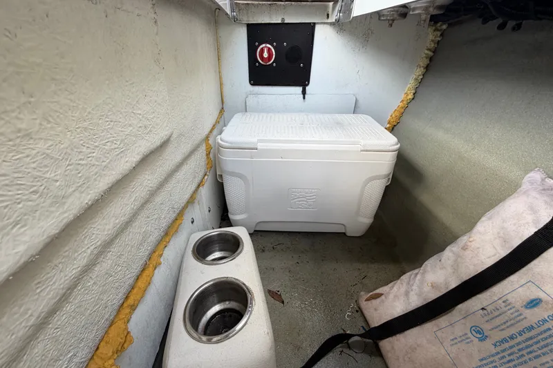 Slide: The Image of Interior of 2023 Crownline Eclipse E235 XS with cooler and storage space. - 68