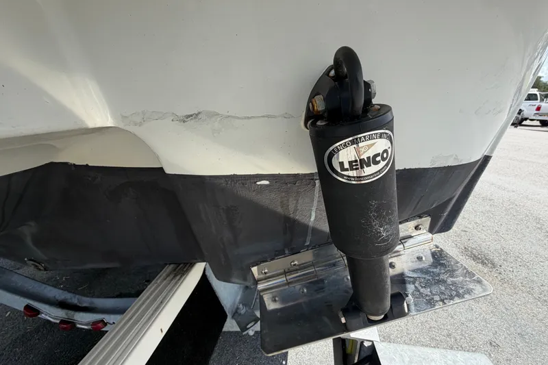 Slide: The Image of 2023 Crownline Eclipse E235 XS boat with Lenco trim tab actuator detail. - 5