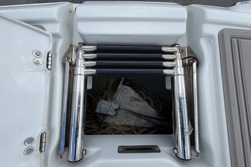 Slide: The Image of An anchor locker with an anchor and rope, surrounded by stainless steel cleats. - 49