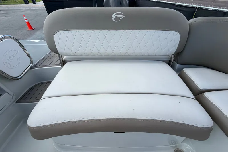 Slide: The Image of 2023 Crownline Eclipse E235 XS boat seating with white and beige upholstery. - 64