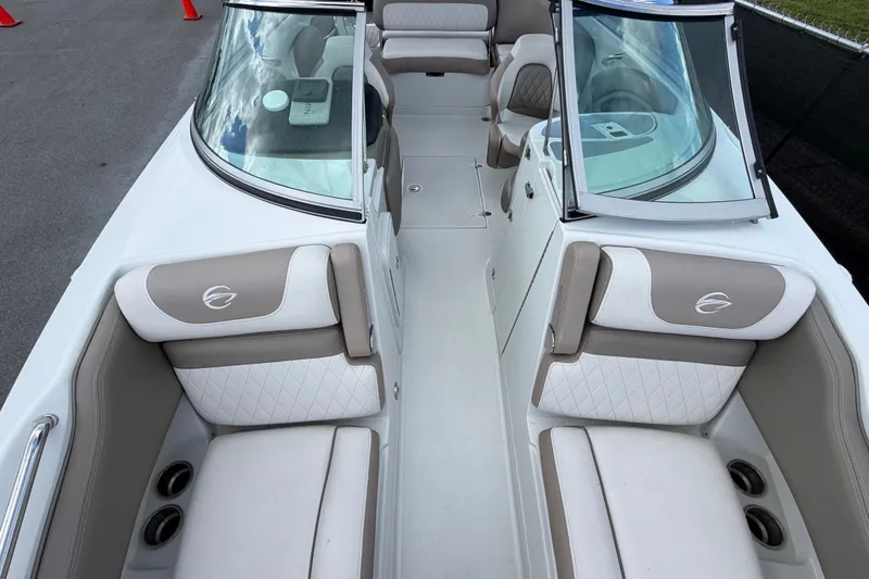 Slide: The Image of 2023 Crownline Eclipse E235 XS boat interior with luxurious seating and modern design. - 56