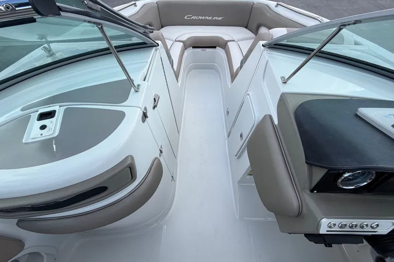Slide: The Image of 2023 Crownline Eclipse E235 XS boat interior with seating and dashboard view. - 41