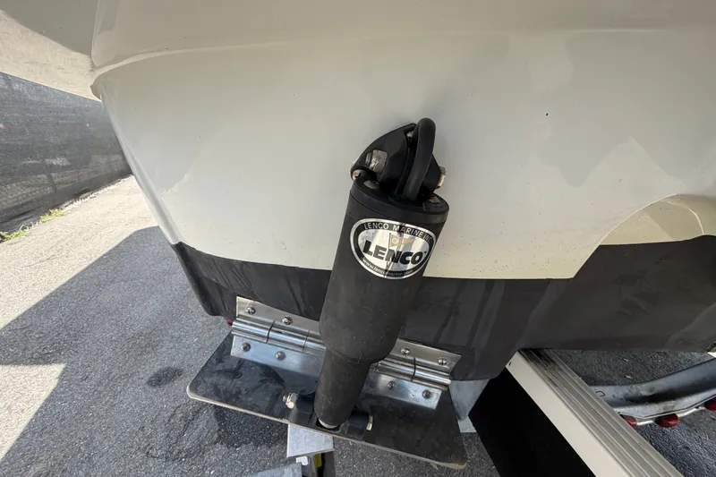 Slide: The Image of 2023 Crownline Eclipse E235 XS boat with Lenco trim tab actuator. - 6