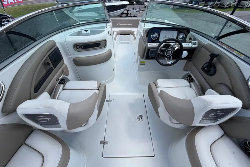 Slide: The Image of 2023 Crownline Eclipse E235 XS boat interior with modern dashboard and seating. - 20