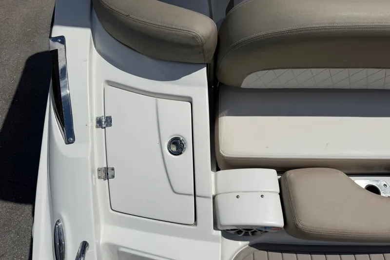 Slide: The Image of 2023 Crownline Eclipse E235 XS boat seating and storage compartment detail. - 14