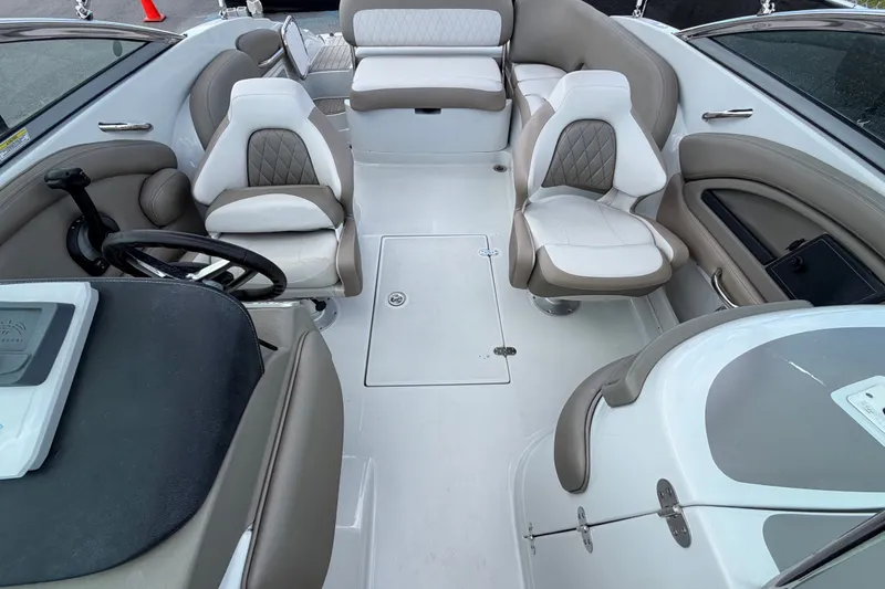 Slide: The Image of 2023 Crownline Eclipse E235 XS boat interior with plush seating and modern design. - 58