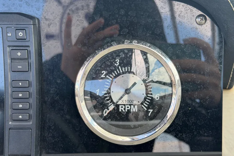Slide: The Image of Tachometer on 2023 Crownline Eclipse E235 XS dashboard, showing RPM gauge. - 37