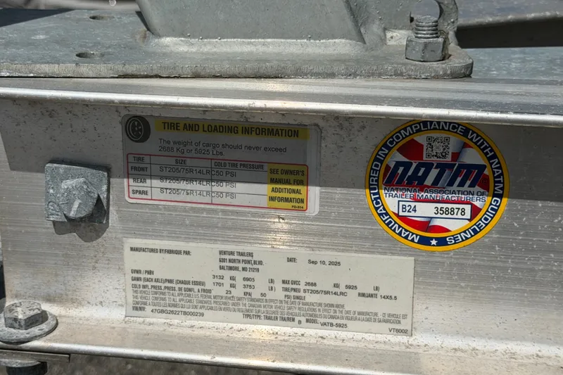 Slide: The Image of 2023 Crownline Eclipse E235 XS trailer tire and loading information plate. - 77