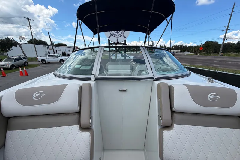 Slide: The Image of 2023 Crownline Eclipse E235 XS boat with sleek design and comfortable seating. - 57
