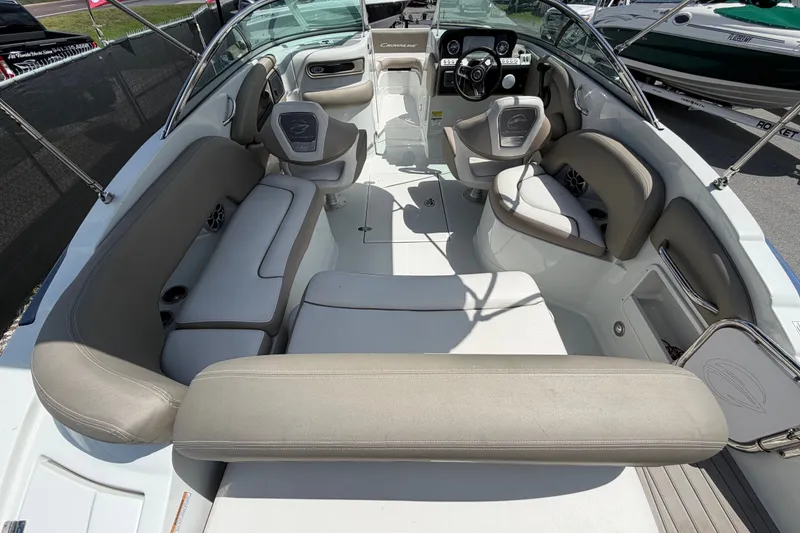Slide: The Image of 2023 Crownline Eclipse E235 XS boat interior with spacious seating and modern design. - 17