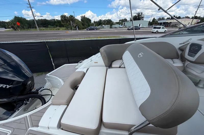 Slide: The Image of 2023 Crownline Eclipse E235 XS boat interior with comfortable seating and modern design. - 71