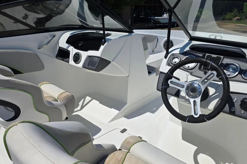 Slide: The Image of Interior of a 2018 Tahoe 700 boat featuring modern steering and dashboard design. - 1