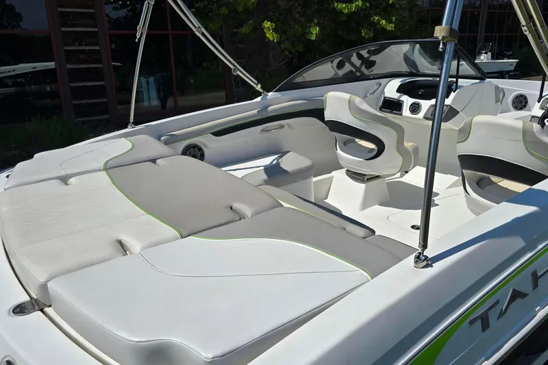 Slide: The Image of Interior of a 2018 Tahoe 700 boat with modern seating and dashboard. - 9