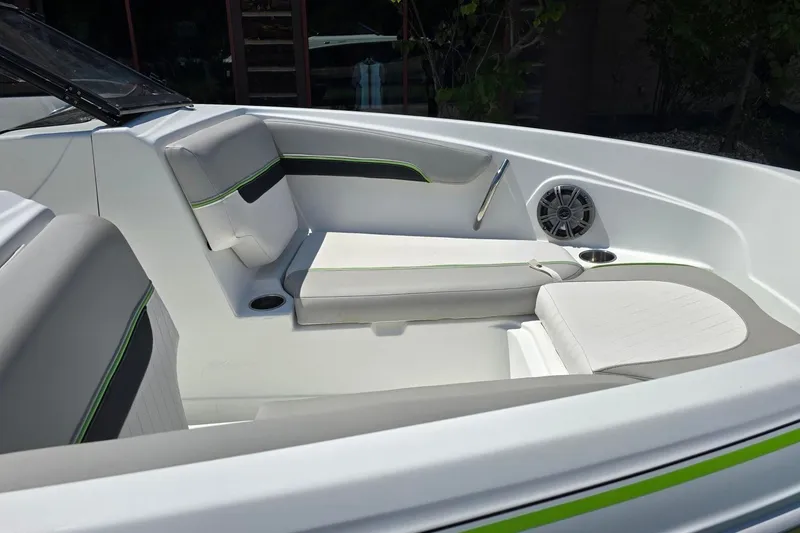 Slide: The Image of Interior of 2018 Tahoe 700 boat with cushioned seating and speaker. - 11
