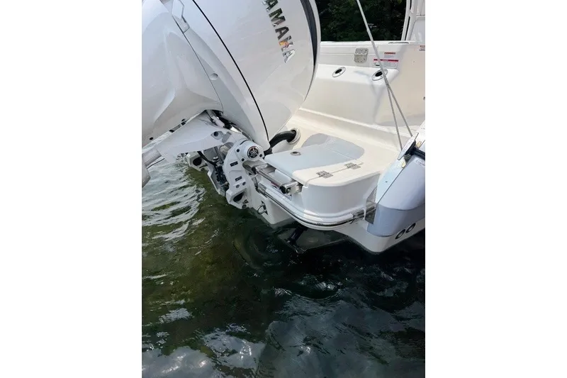 Slide: The Image of 2026 Robalo R270 Center Console boat with Yamaha outboard engine on water. - 5