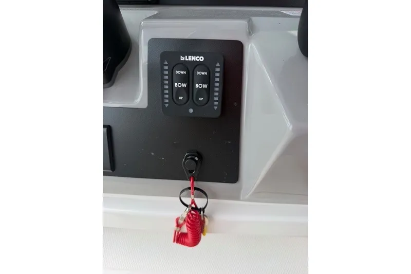 Slide: The Image of Control panel of 2026 Robalo R270 Center Console boat with Lenco trim tab switches. - 20