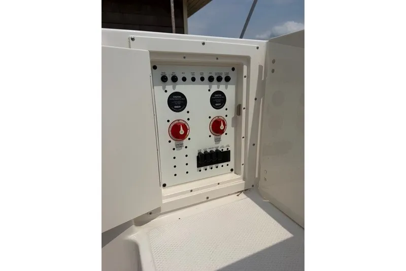 Slide: The Image of Electrical panel on 2026 Robalo R270 Center Console boat, featuring switches and controls. - 34