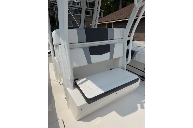 Slide: The Image of 2026 Robalo R270 Center Console boat seating area with modern design and comfortable cushions. - 27