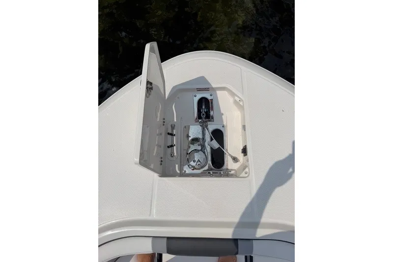 Slide: The Image of 2026 Robalo R270 Center Console anchor compartment with open hatch. - 38