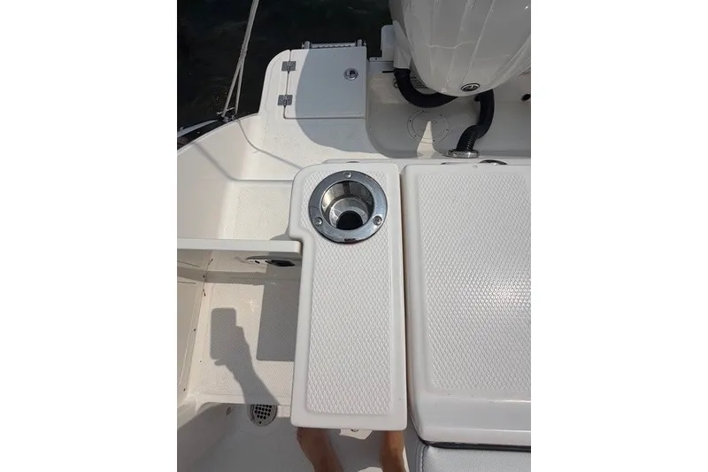 Slide: The Image of 2026 Robalo R270 Center Console boat deck with cup holder and storage. - 37
