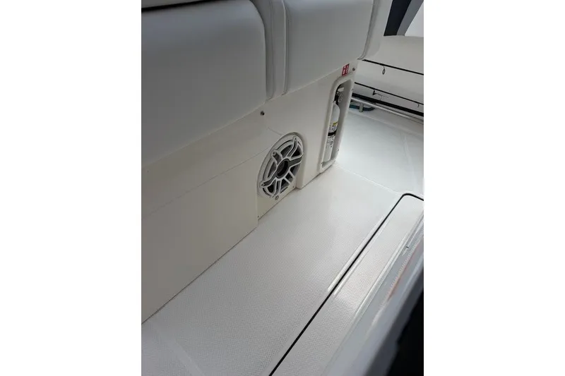 Slide: The Image of 2026 Robalo R270 Center Console interior with speaker and fire extinguisher. - 36