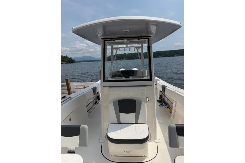 Slide: The Image of 2026 Robalo R270 Center Console boat on a serene lake. - 32