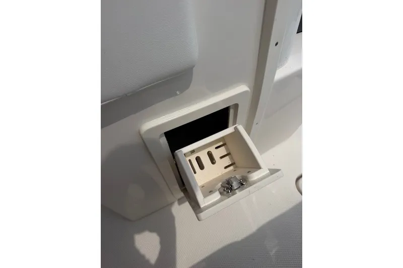 Slide: The Image of 2026 Robalo R270 Center Console boat storage compartment detail. - 11