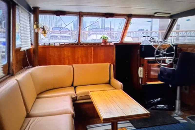 Slide: The Image of Interior of 1979 Tollycraft 40 Tri-Cabin Motor Yacht with cozy seating and helm. - 25