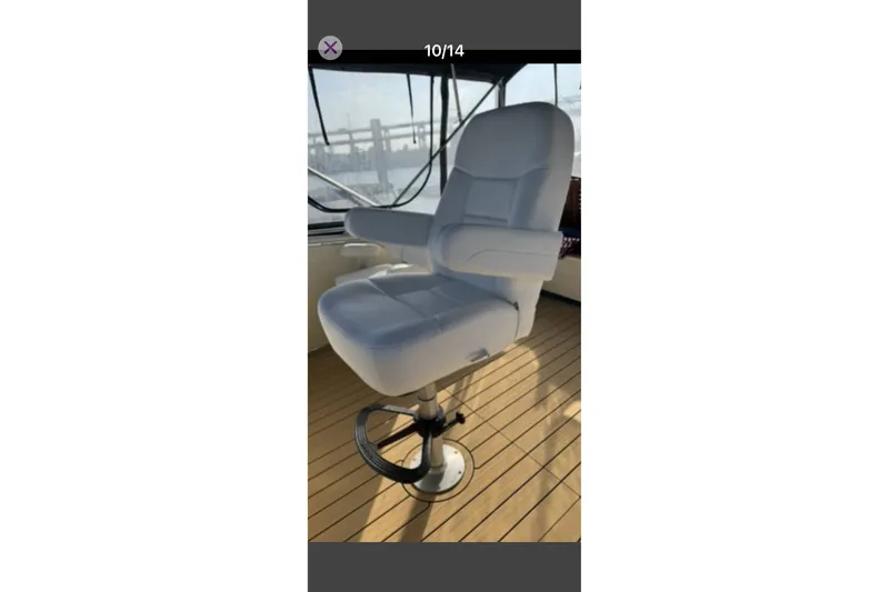 Slide: The Image of Captain's chair on 1979 Tollycraft 40 Tri-Cabin Motor Yacht, featuring sleek design and comfort. - 9
