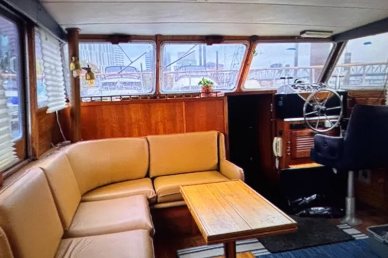 Slide: The Image of Interior of 1979 Tollycraft 40 Tri-Cabin Motor Yacht with seating and helm. - 19