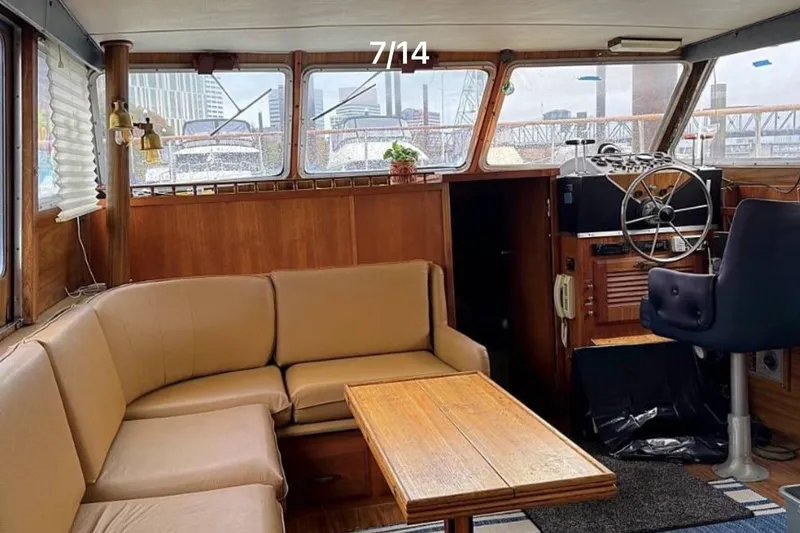 Slide: The Image of Interior of 1979 Tollycraft 40 Tri-Cabin Motor Yacht with seating and helm. - 3