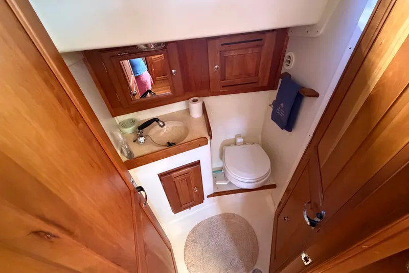Slide: The Image of Compact wooden bathroom interior on a 2011 Tartan 4300 yacht. - 18