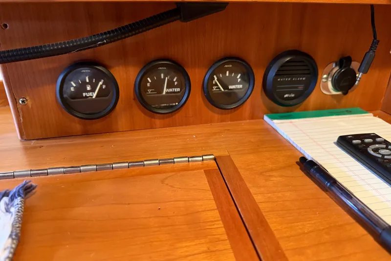 Slide: The Image of Control panel of a 2011 Tartan 4300 yacht with fuel and water gauges. - 23