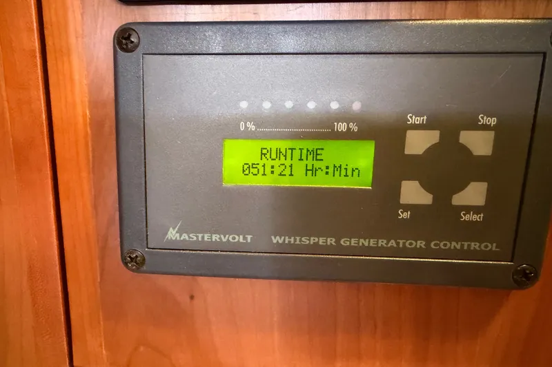 Slide: The Image of Mastervolt Whisper Generator Control displaying 51 hours runtime on Tartan 4300, 2011 model. - 24
