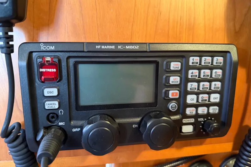 Slide: The Image of Marine radio equipment on a 2011 Tartan 4300 yacht, featuring distress and communication controls. - 25