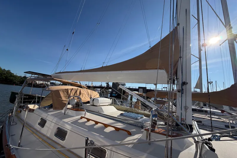 Slide: The Image of Sailboat Tartan 4300, 2011 model, docked under clear blue sky. - 28