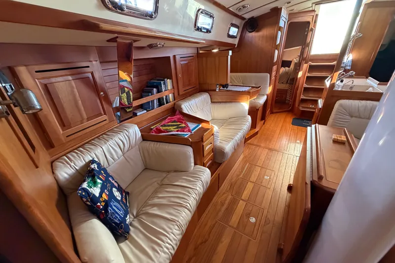Slide: The Image of Luxurious 2011 Tartan 4300 yacht interior with plush seating and wooden cabinetry. - 17