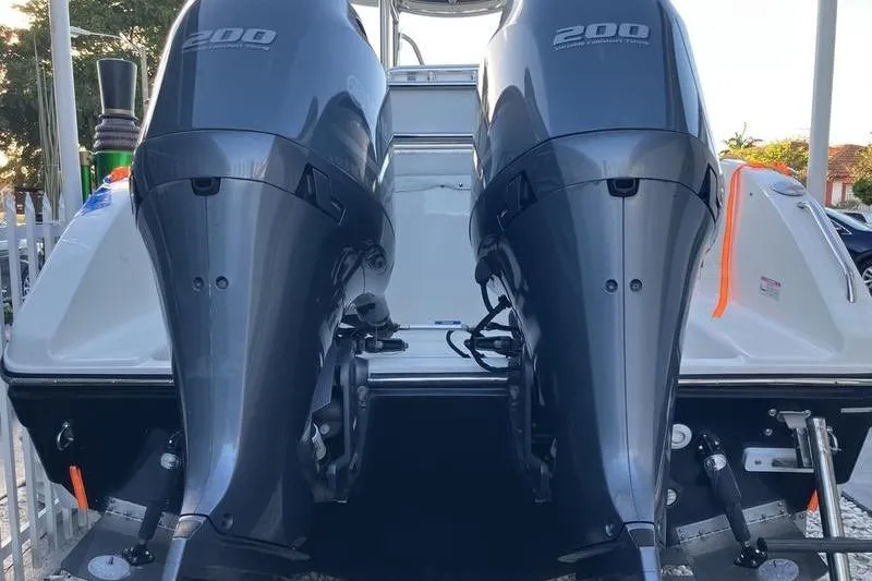 Slide: The Image of Twin 200 horsepower outboard motors on a 2014 Century boat. - 2