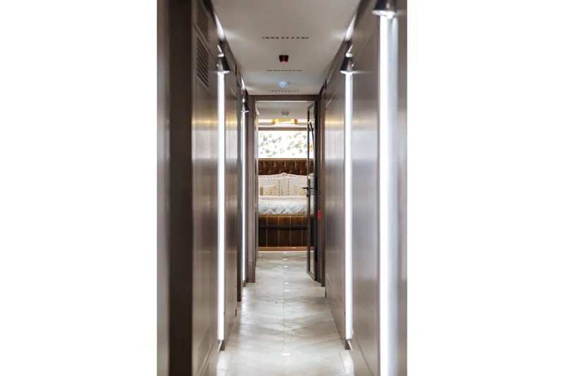 Slide: The Image of Luxurious hallway inside 2027 Sirena 118 yacht, leading to a plush bedroom. - 20
