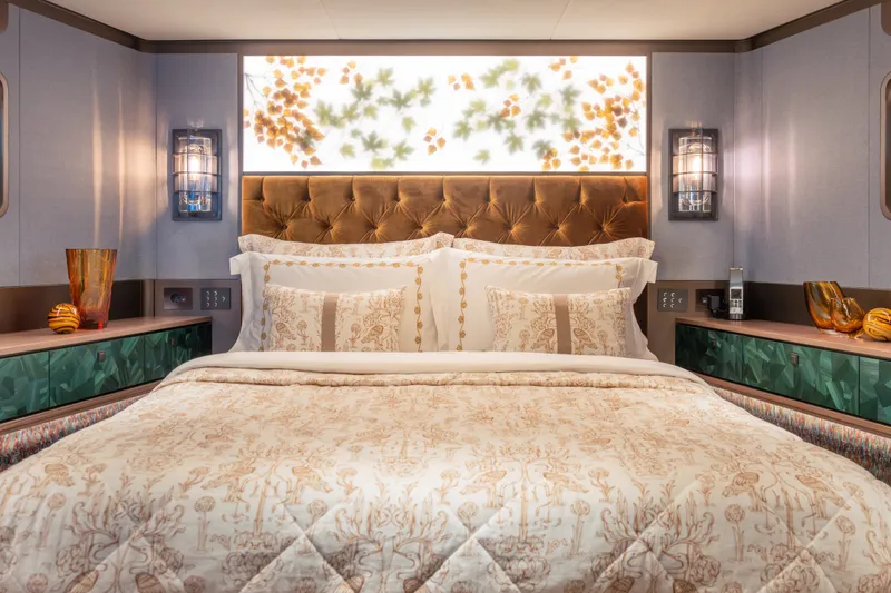 Slide: The Image of Luxurious Sirena 118 yacht bedroom with elegant bedding and ambient lighting, 2027 model. - 21