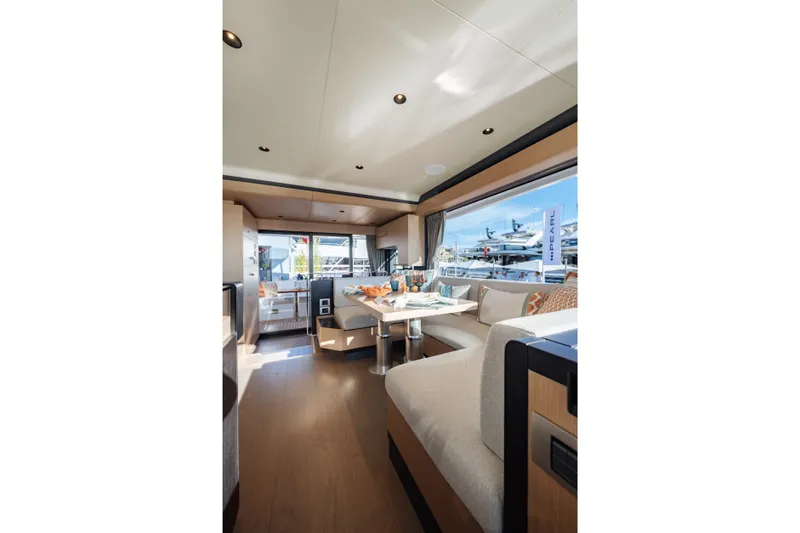 Slide: The Image of Luxurious interior of 2027 Sirena 118 yacht with elegant seating and large windows. - 15